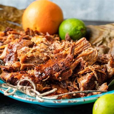  Cochinita Pibil: Ein schmelzender Triumph der Yucatán Küche - Zart gebratenes Schwein trifft auf einen Hauch von Zitrusfrische!